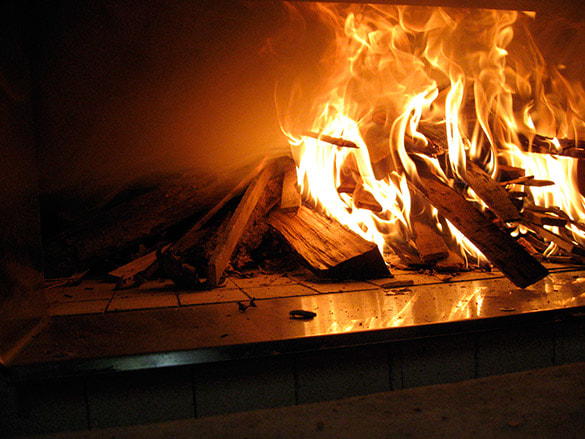 photo of burning logs in oven